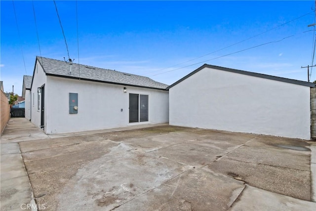 14867 Roxton Ave, Gardena, CA 90249 - rear view of property with stucco siding, a patio, and a shingled roof