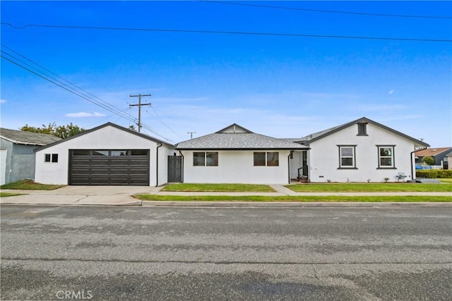 14867 Roxton Ave, Gardena, CA 90249 - bungalow with stucco siding, an outdoor structure, and a detached garage