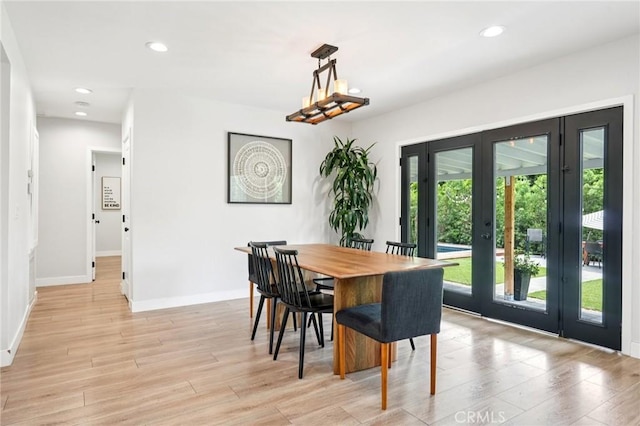 20042 Lassen St, Chatsworth, CA 91311 - dining room featuring french doors, light wood finished floors, and recessed lighting