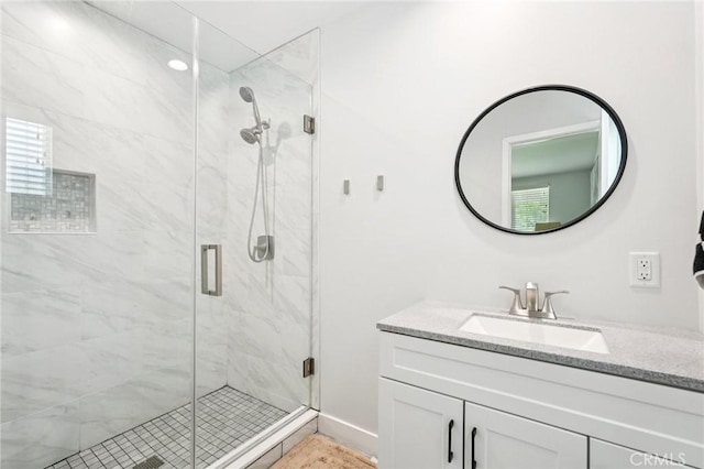 20042 Lassen St, Chatsworth, CA 91311 - bathroom featuring vanity and a marble finish shower