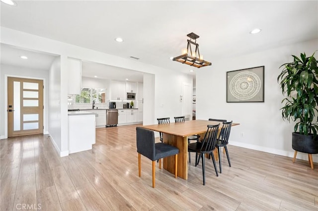 20042 Lassen St, Chatsworth, CA 91311 - dining space featuring light wood-style flooring and recessed lighting