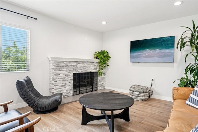 20042 Lassen St, Chatsworth, CA 91311 - living room featuring wood finished floors, recessed lighting, and a fireplace