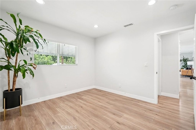 20042 Lassen St, Chatsworth, CA 91311 - empty room with a smoke detector, light wood-style floors, and recessed lighting