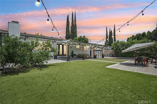 20042 Lassen St, Chatsworth, CA 91311 - view of grassy yard with a patio area