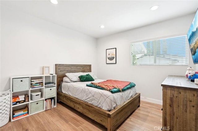 20042 Lassen St, Chatsworth, CA 91311 - bedroom with wood finished floors and recessed lighting