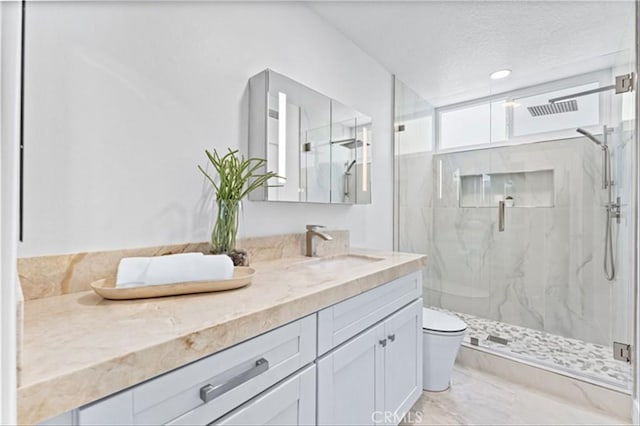 15 Glastonbury Pl, Laguna Niguel, CA 92677 - bathroom with a marble finish shower, vanity, and marble finish floors