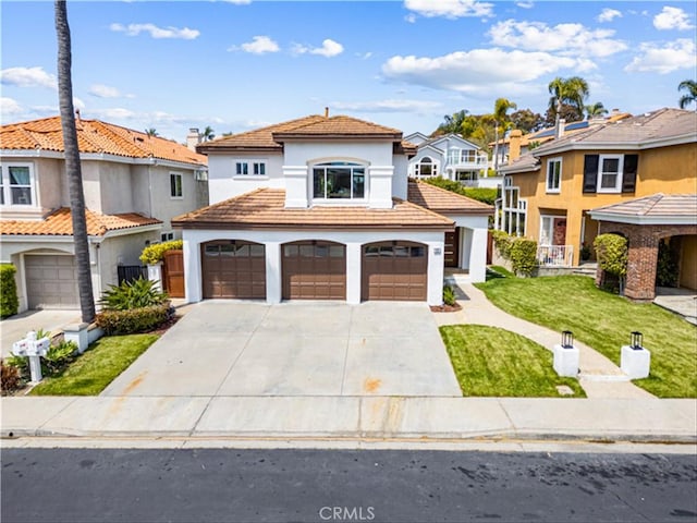 15 Glastonbury Pl, Laguna Niguel, CA 92677 - view of front of property featuring stucco siding, driveway, a residential view, an attached garage, and a front lawn