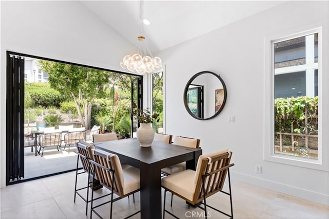 15 Glastonbury Pl, Laguna Niguel, CA 92677 - dining space featuring a chandelier, plenty of natural light, lofted ceiling, and light tile patterned floors