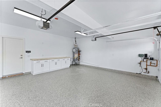 15 Glastonbury Pl, Laguna Niguel, CA 92677 - garage featuring a garage door opener and secured water heater