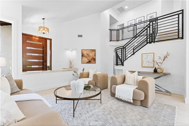 15 Glastonbury Pl, Laguna Niguel, CA 92677 - living area with stairway, a chandelier, and high vaulted ceiling
