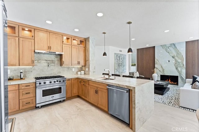 15 Glastonbury Pl, Laguna Niguel, CA 92677 - kitchen featuring appliances with stainless steel finishes, a peninsula, glass insert cabinets, a fireplace, and recessed lighting