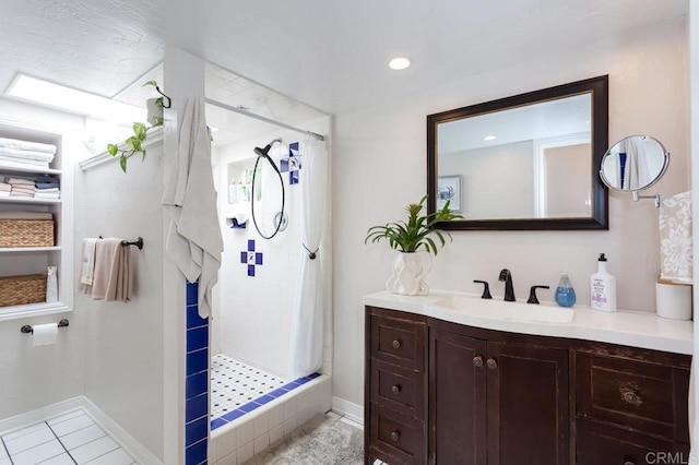 121 Cadmus St, Encinitas, CA 92024 - full bathroom with a stall shower, tile patterned flooring, and vanity
