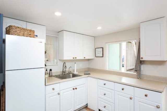 121 Cadmus St, Encinitas, CA 92024 - kitchen featuring freestanding refrigerator, white cabinetry, recessed lighting, and light countertops