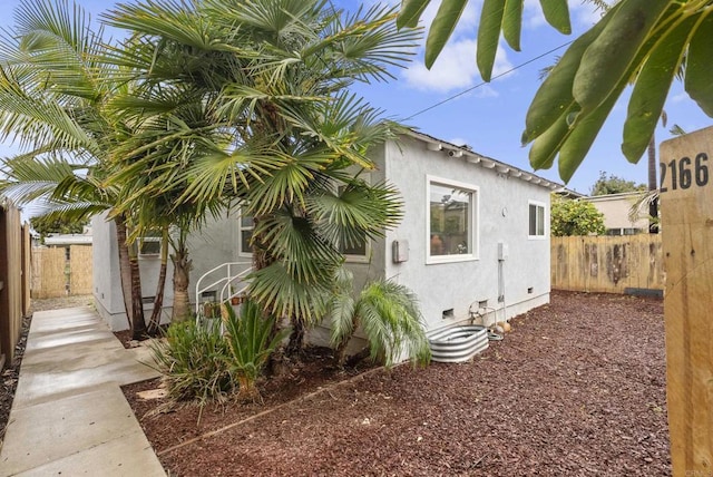 216466 S 40th St, San Diego, CA 92113 - view of side of home with stucco siding and crawl space