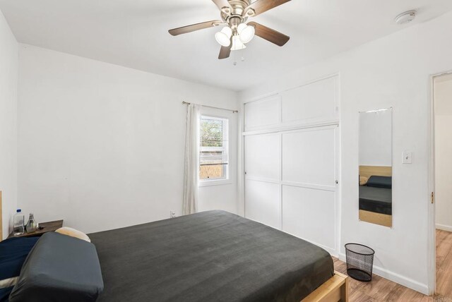 216466 S 40th St, San Diego, CA 92113 - bedroom with light wood-style floors, a closet, and ceiling fan