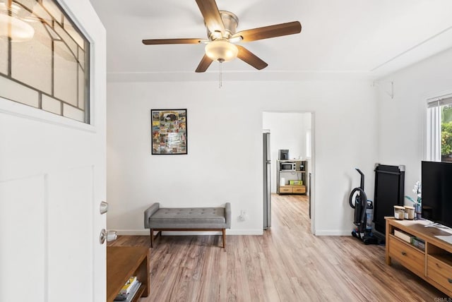 216466 S 40th St, San Diego, CA 92113 - living area with light wood-style flooring and a ceiling fan