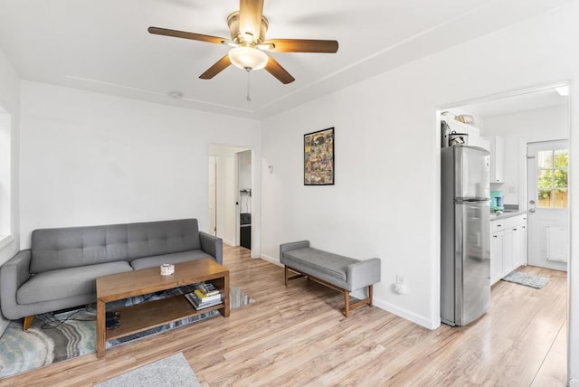 216466 S 40th St, San Diego, CA 92113 - living room with light wood-style flooring and a ceiling fan