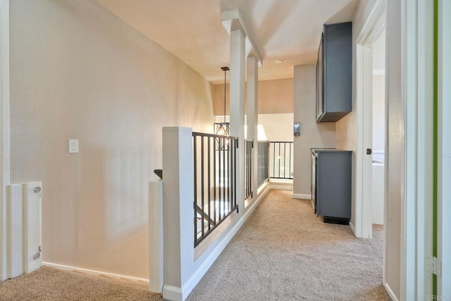 1675 Bronco Way, Oceanside, CA 92057 - corridor featuring light colored carpet and an upstairs landing