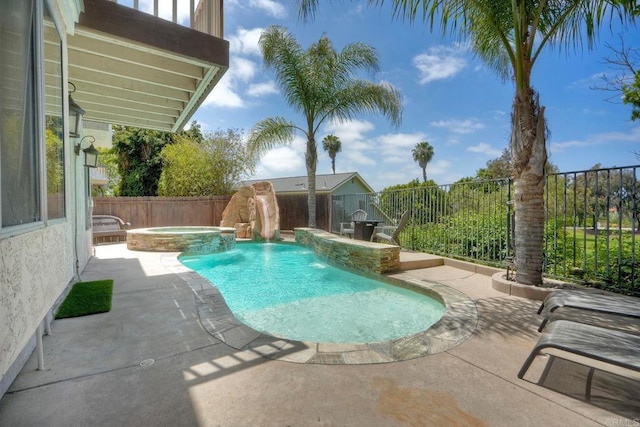 1675 Bronco Way, Oceanside, CA 92057 - view of swimming pool featuring a patio area, a pool with connected hot tub, and a fenced backyard