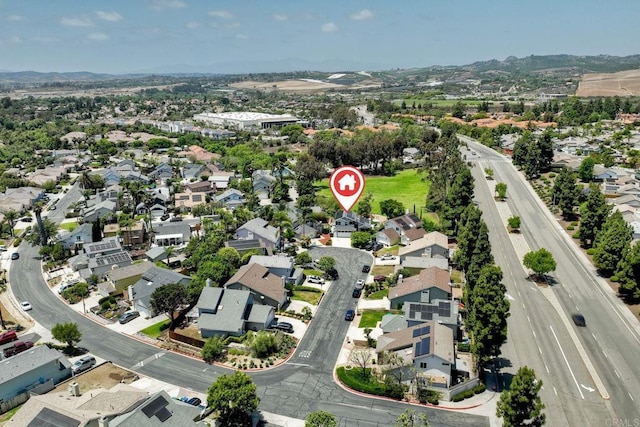 1675 Bronco Way, Oceanside, CA 92057 - aerial view of property and surrounding area with nearby suburban area and a mountain backdrop