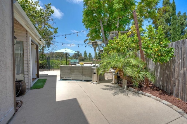 1675 Bronco Way, Oceanside, CA 92057 - fenced backyard featuring a patio area and outdoor lounge area