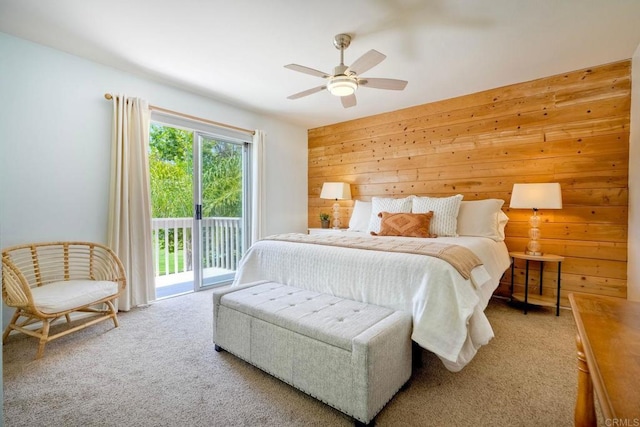 1675 Bronco Way, Oceanside, CA 92057 - carpeted bedroom featuring access to outside, wood walls, and a ceiling fan