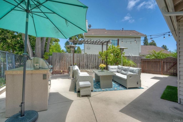 1675 Bronco Way, Oceanside, CA 92057 - fenced backyard featuring a patio area, an outdoor living space, a pergola, and an outdoor kitchen