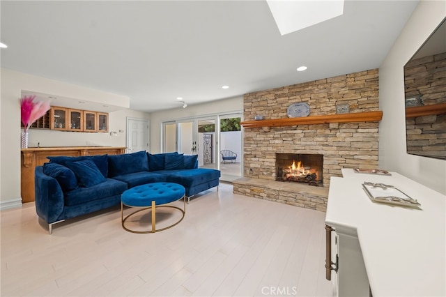 29603 Highpoint Rd, Rancho Palos Verdes, CA 90275 - living area with wood finished floors, a fireplace, bar, recessed lighting, and french doors