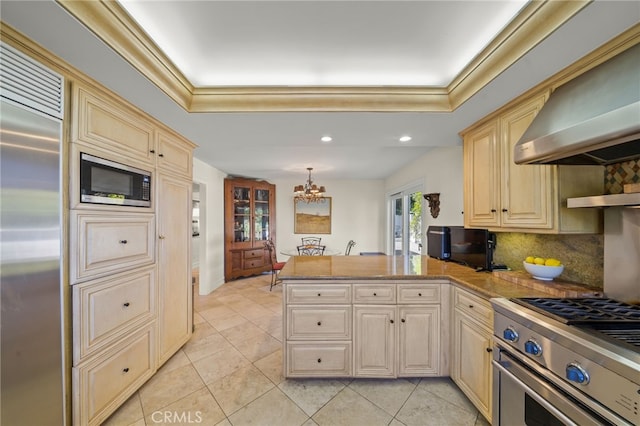 29603 Highpoint Rd, Rancho Palos Verdes, CA 90275 - kitchen with built in appliances, a peninsula, wall chimney exhaust hood, a chandelier, and light tile patterned floors