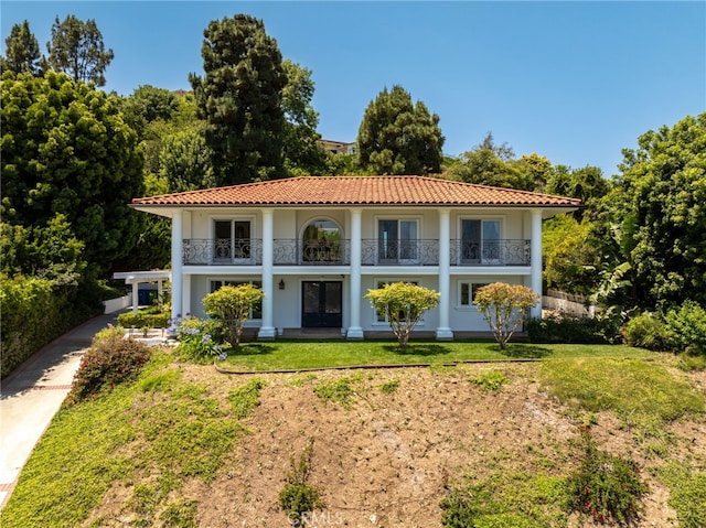 29603 Highpoint Rd, Rancho Palos Verdes, CA 90275 - view of front facade featuring a balcony, a tiled roof, stucco siding, and a front lawn