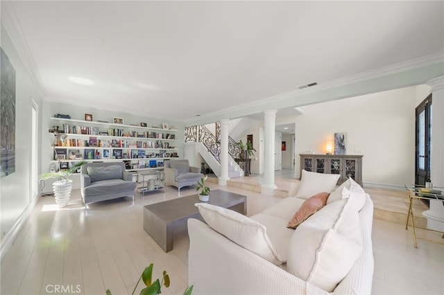 29603 Highpoint Rd, Rancho Palos Verdes, CA 90275 - living room featuring decorative columns, crown molding, light wood-type flooring, and stairs