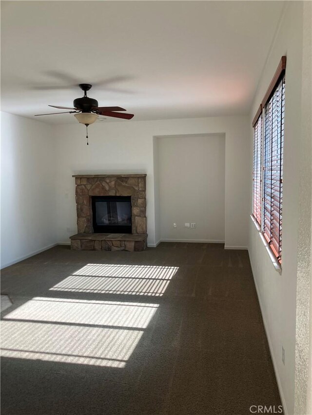 1830 Nevada St, Gridley, CA 95948 - unfurnished living room with carpet flooring, a ceiling fan, and a stone fireplace