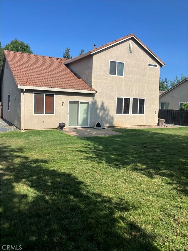 1830 Nevada St, Gridley, CA 95948 - back of property with a patio, stucco siding, and a tiled roof