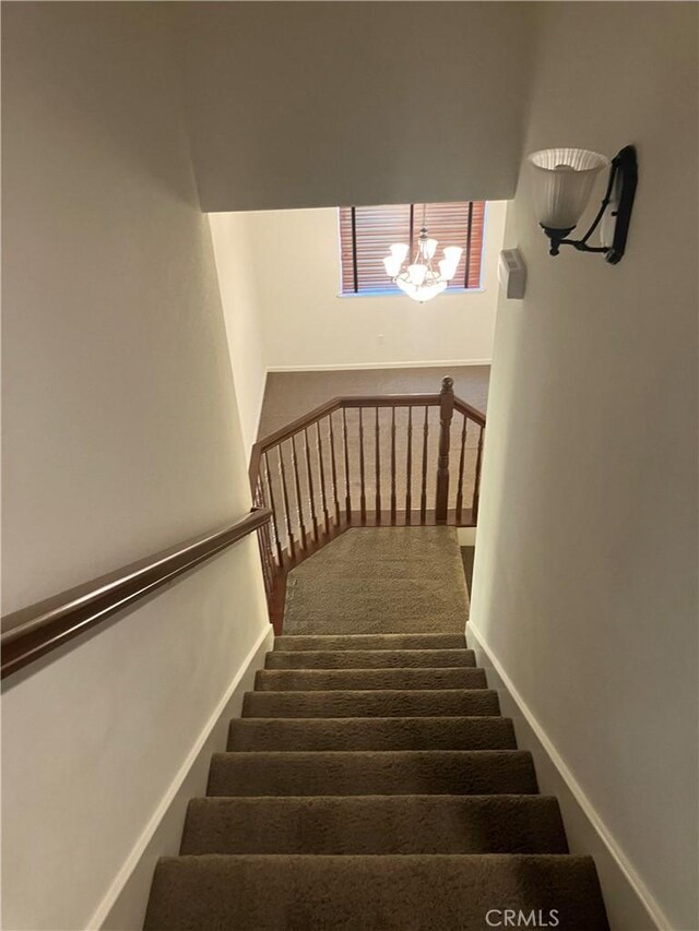1830 Nevada St, Gridley, CA 95948 - stairway featuring carpet flooring and a chandelier