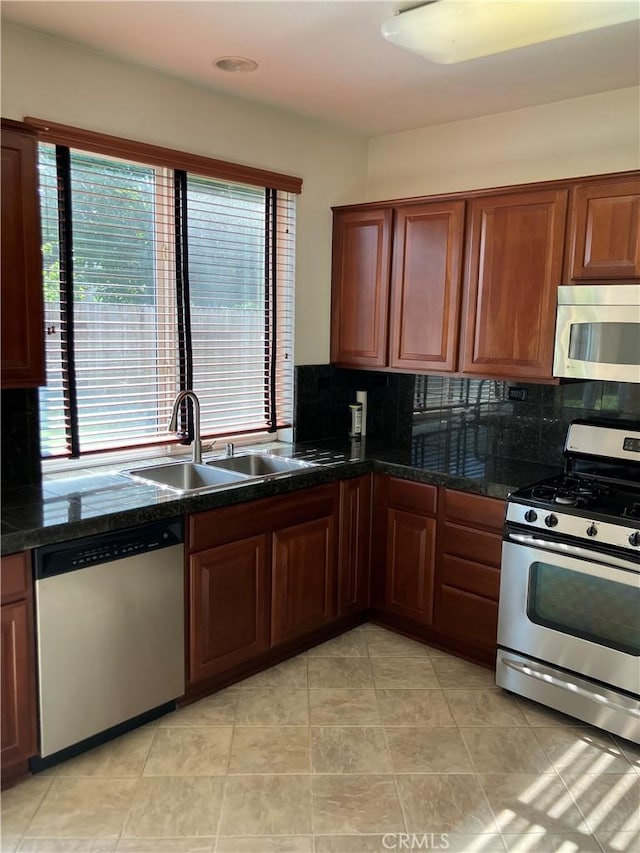 1830 Nevada St, Gridley, CA 95948 - kitchen featuring appliances with stainless steel finishes, healthy amount of natural light, and decorative backsplash