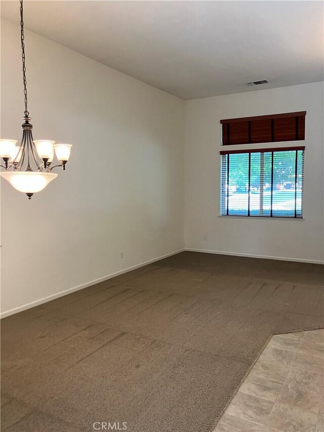 1830 Nevada St, Gridley, CA 95948 - carpeted spare room featuring a chandelier and baseboards