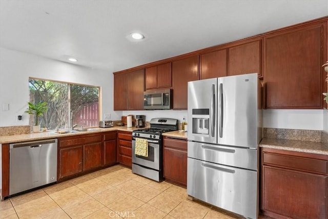 2271 Stanford St, San Bernardino, CA 92407 - kitchen featuring stainless steel appliances, recessed lighting, light tile patterned floors, and light countertops