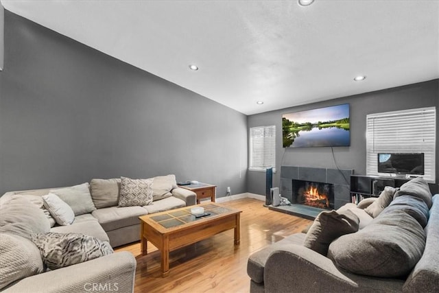 2271 Stanford St, San Bernardino, CA 92407 - living area featuring light wood finished floors, a tile fireplace, and recessed lighting