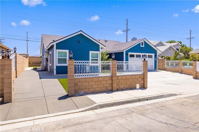 3838 Balmont St, Lancaster, CA 93536 - view of front of house featuring concrete driveway, a fenced front yard, and a garage
