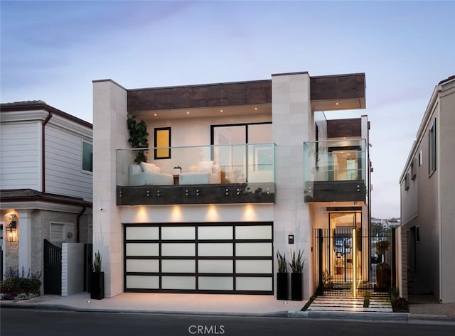 642 Via Lido Nord, Newport Beach, CA 92663 - modern home featuring an attached garage, a balcony, and concrete driveway