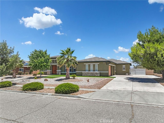 7219 Evening Star Rose Ct, Oak Hills, CA 92344 - view of front facade featuring stucco siding and concrete driveway