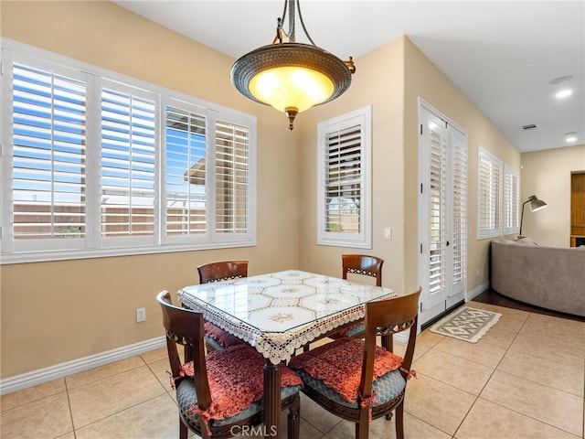 7219 Evening Star Rose Ct, Oak Hills, CA 92344 - dining area with light tile patterned flooring and recessed lighting