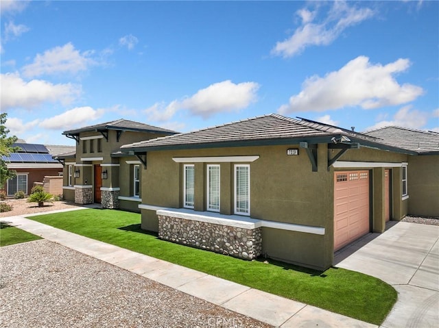 7219 Evening Star Rose Ct, Oak Hills, CA 92344 - view of front of home with concrete driveway, stucco siding, a garage, and a front lawn