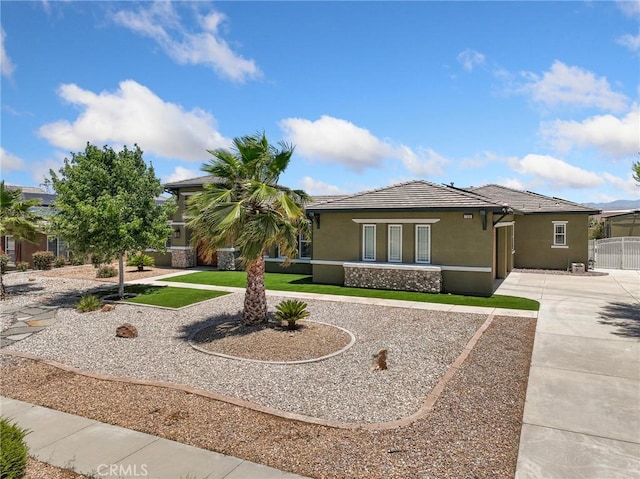 7219 Evening Star Rose Ct, Oak Hills, CA 92344 - view of front of property featuring stucco siding