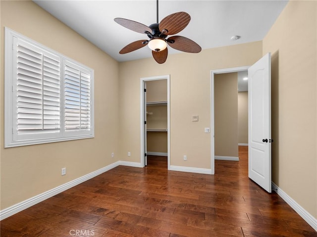 7219 Evening Star Rose Ct, Oak Hills, CA 92344 - unfurnished bedroom with wood finished floors, a spacious closet, ceiling fan, and a closet
