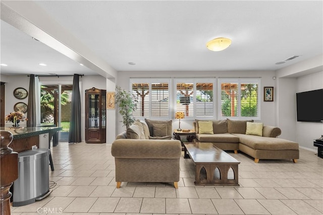1341 Stanfill Rd, Palmdale, CA 93551 - living area featuring plenty of natural light, light tile patterned floors, and recessed lighting