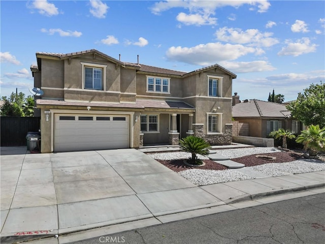 1341 Stanfill Rd, Palmdale, CA 93551 - view of front of property featuring stucco siding, an attached garage, and driveway