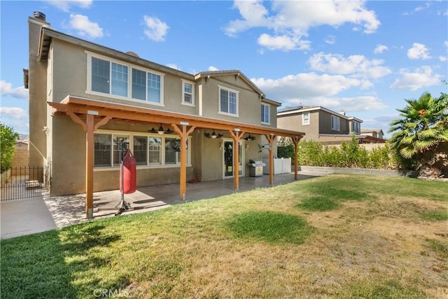 1341 Stanfill Rd, Palmdale, CA 93551 - rear view of property featuring a ceiling fan, stucco siding, a patio area, and a chimney