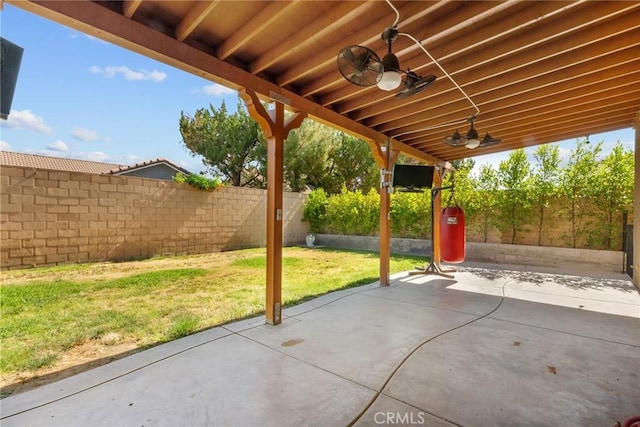 1341 Stanfill Rd, Palmdale, CA 93551 - fenced backyard with ceiling fan and a patio area