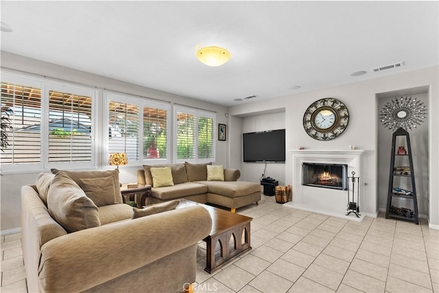 1341 Stanfill Rd, Palmdale, CA 93551 - living area with light tile patterned floors and a lit fireplace
